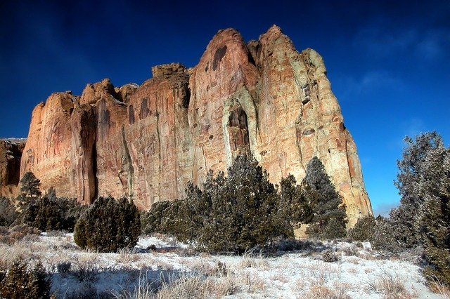 Tent near volcanic rock formations in El Malpais, raw wilderness camping in New Mexico.

