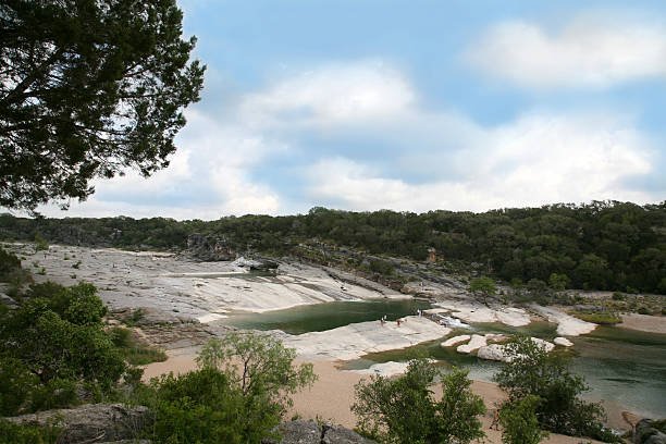 17 Best Places To Camp In Texas 8 Waterfall and tents in Pedernales Falls State Park, Texas