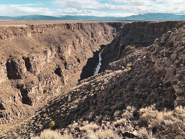 Riverside campsite in Rio Grande Del Norte, scenic canyon camping in New Mexico.