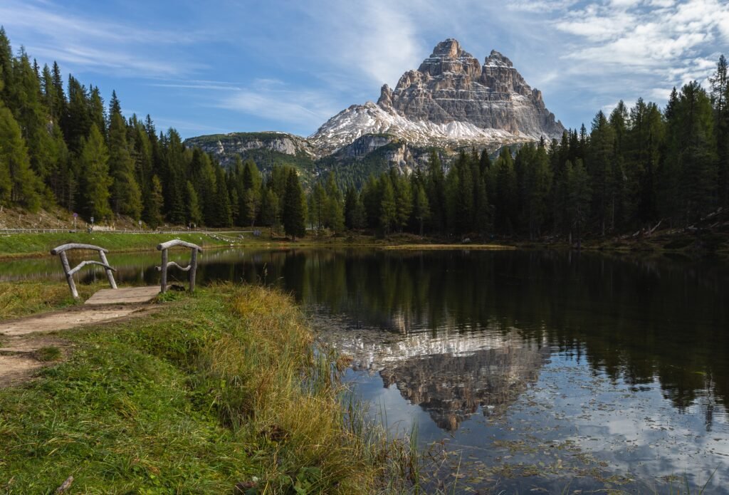  Tent beside alpine lake with mountain backdrop in Sawtooth National Recreation Area.