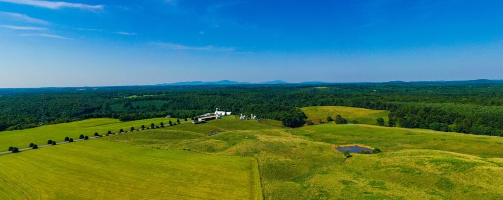 Tent pitched in a grassy meadow at Sky Meadows State Park, offering classic rural camping in Virginia.
